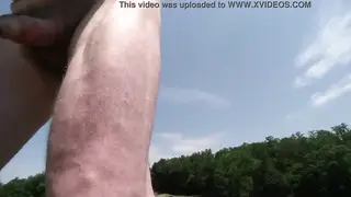 Mature Daddy Strokes Outdoors on a Dam