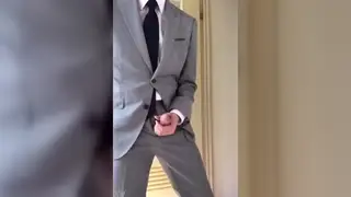 Suited Guy in a Tight Vest Jerks Off Until He Cums
