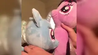 Two Playful Partners Share a Toy Session on Camera