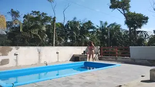 Lesbian Poolside Tease Ends in Outdoor Handjob