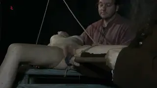 Tattooed Sub Squirts Under Wand in Bondage