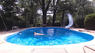 Slim Teen Skinny Dips Poolside While Partner Watches