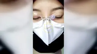 Hijab-Clad Asian Woman Explores Solo Pleasure