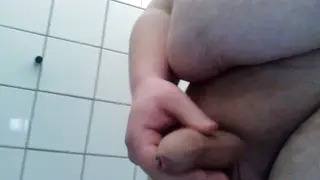 Heavy Guy Strokes His Big Cock in the Bathroom