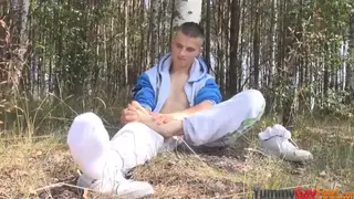 Muscular Hunk Jerks Off Outdoors With Foot Play