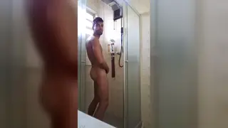 Well Endowed Guy Strokes Himself in a Bathroom