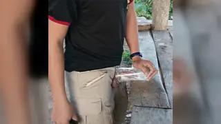 Hairy Asian Bear Beats Off Outside With a Toy