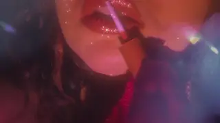Solo Woman Teases Her Lips with a Toy Close-Up