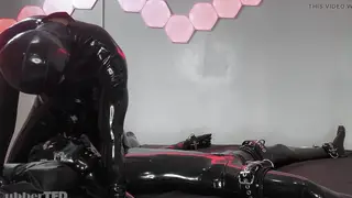 Bound Twink Endures Relentless Edging in Latex Gear
