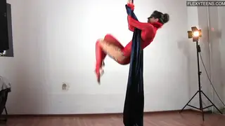 Brunette Gymnast Displays Flexibility in Lingerie
