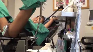 Tattooed Brunette Screams Through Multiple Orgasms on a Medical Table