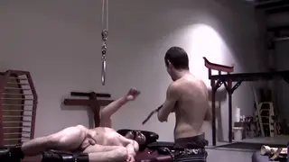 Bound Muscle Hunk Endures Intense Rope Session