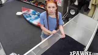 Petite Redhead Rides Hard in a Pawnshop Deal