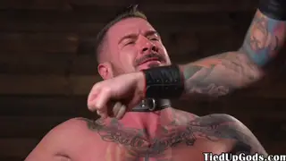Muscular Sub Restrained for Intense Cock Whipping Session