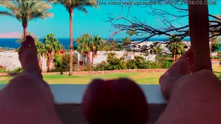 Muscular European Strokes His Uncut Cock on a Hotel Balcony