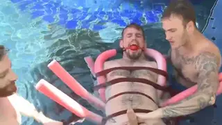 Muscular Hunk Submits to Poolside Bondage Play