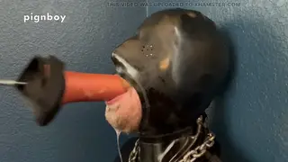 Muscular Rubber Gimp Endures Deep Throat Training