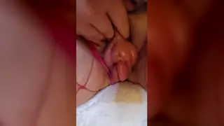 Brunette Domme Presses Pumped Pussy in Solo Femdom Clip
