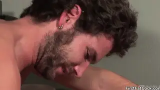 Two Men Share an Oral Moment in Soft Light
