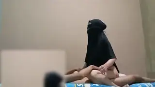 Hijab-Clad Neighbour Takes a Creampie While Husband Watches