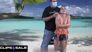 Petite Brunette Giggles Through a Tickling Session on the Beach