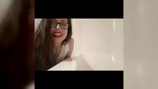 Petite Brunette Pisses Into Her Own Face in Bathroom Fetish Clip