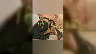 Belly Dancer Strips Slowly in Dimly Lit Room