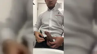 Latino Daddy Strokes Uncut Cock in Office Bathroom