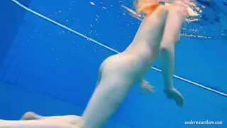 Redhead European Teen Masturbates in Outdoor Pool