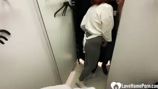 Redhead in a Skirt Takes It Doggystyle in a Dressing Room