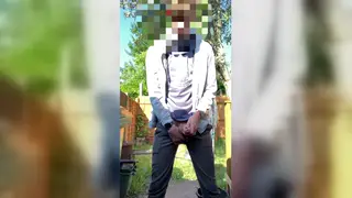 Teen Releases a Golden Stream Outdoors