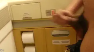 Quick Handjob Ends in Cumshot Inside an Airplane Lavatory