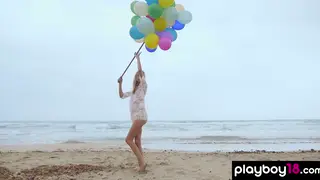 Blonde European MILF Teases Balloons on Sunny Beach