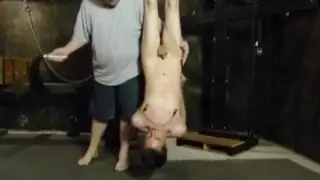 Bound Twink Suspended by Feet for Punishment