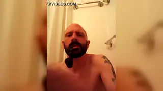 Skinhead Smokes Cigar While Stroking His Thick Cock