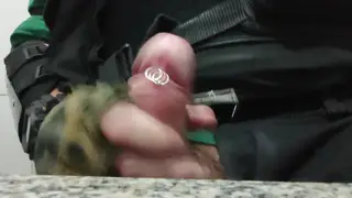 Uniformed Officer Strokes Pierced Cock in Public Bathroom