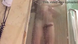 Two Men Share an Intimate Shower at a Hotel