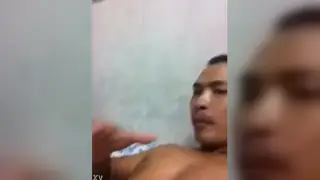 Asian Man Savors Intimate Moment After Passionate Release