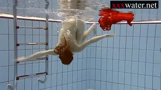 Redhead Teen Shows Off Lingerie by the Pool