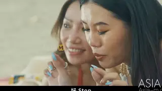 Busty Asian Brunette Stars in a Beach Threesome