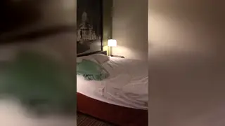 Solo Performer Strips and Teases in Hotel Room Setting