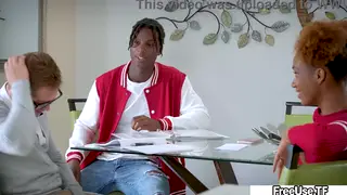 Tutor Watches Two Students Share Her on a Desk