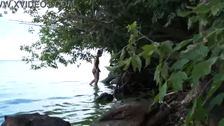 Mature Woman Poses Nude by the River at Dusk