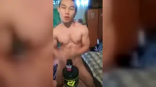 Asian Performer Strips Slowly on Camera