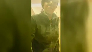 Busty Woman Pisses Outdoors in a Public Bathroom