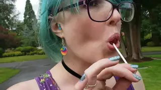 Busty Curvy Woman Sucks Lollipops in Cemetery Cosplay