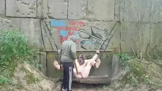 Hairy Bear Bound Outdoors for Foot Spanking
