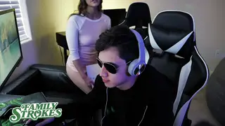 Stepsister Sucks Stepbrother While He Keeps Gaming