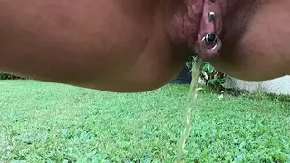 European MILF Pisses Outdoors In Leather And Heels