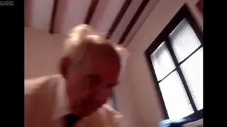 Suited Grandfather Welcomes Eager Young Mouth